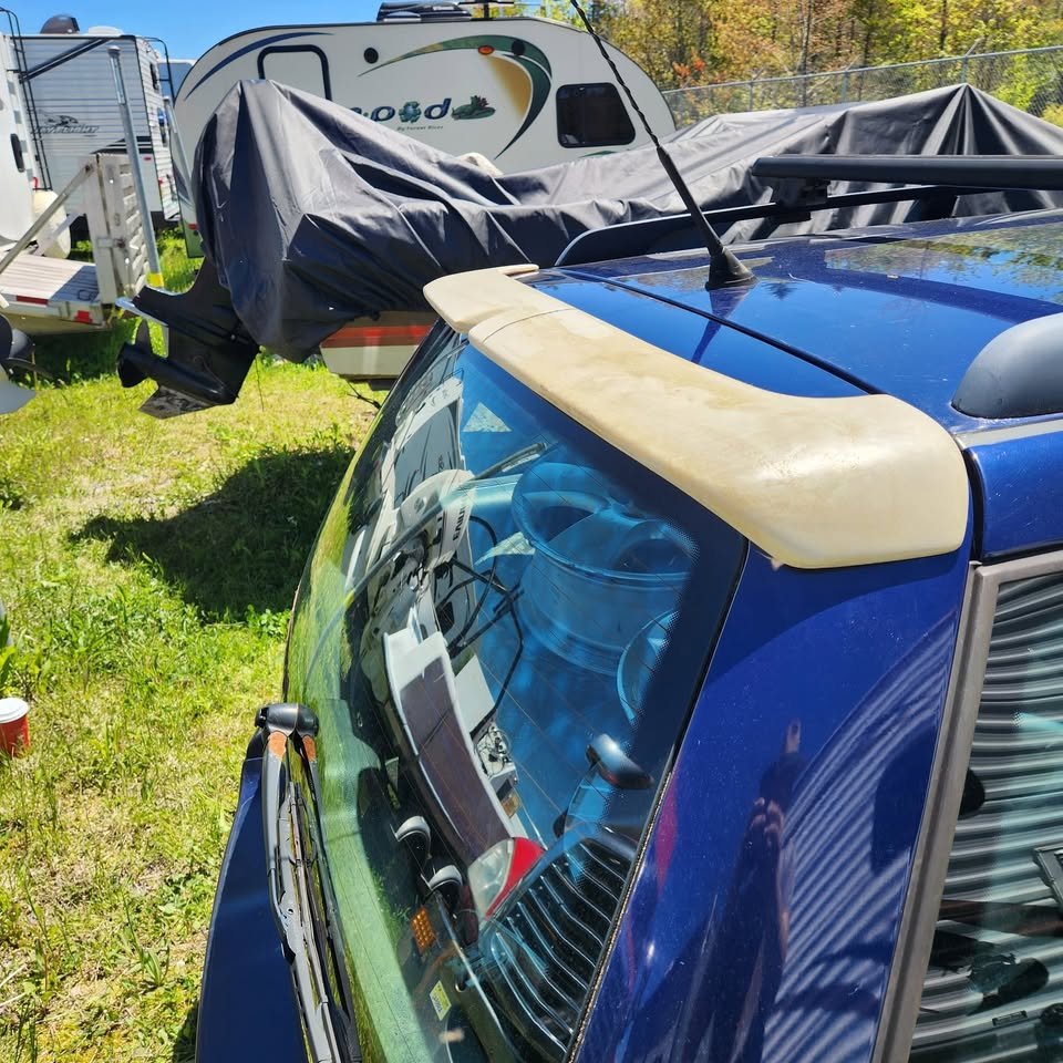 Volkswagen MK4 wagon with OEM-style rear hatch spoiler - close-up of spoiler fitment